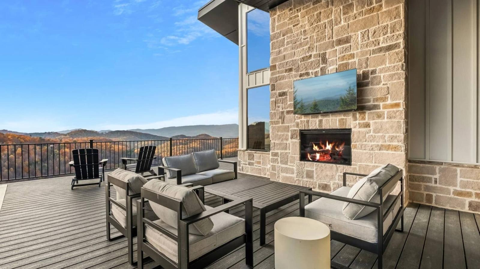 Outdoor fireplace with mountain views on deck in Pigeon Forge